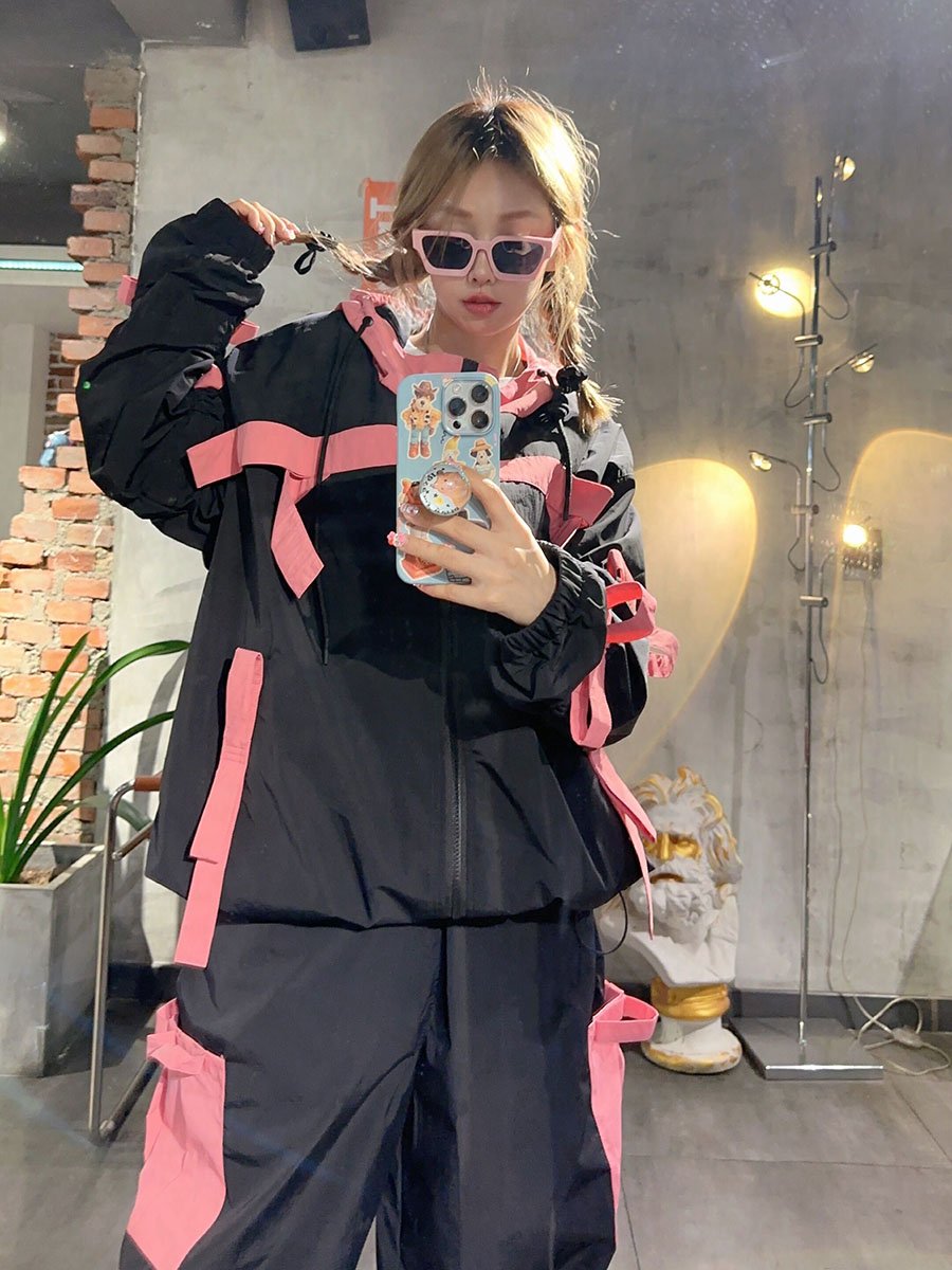k-skigirls with a professional snow-skinpants jacket, scrambling the water-proof, wind-proof top of winter