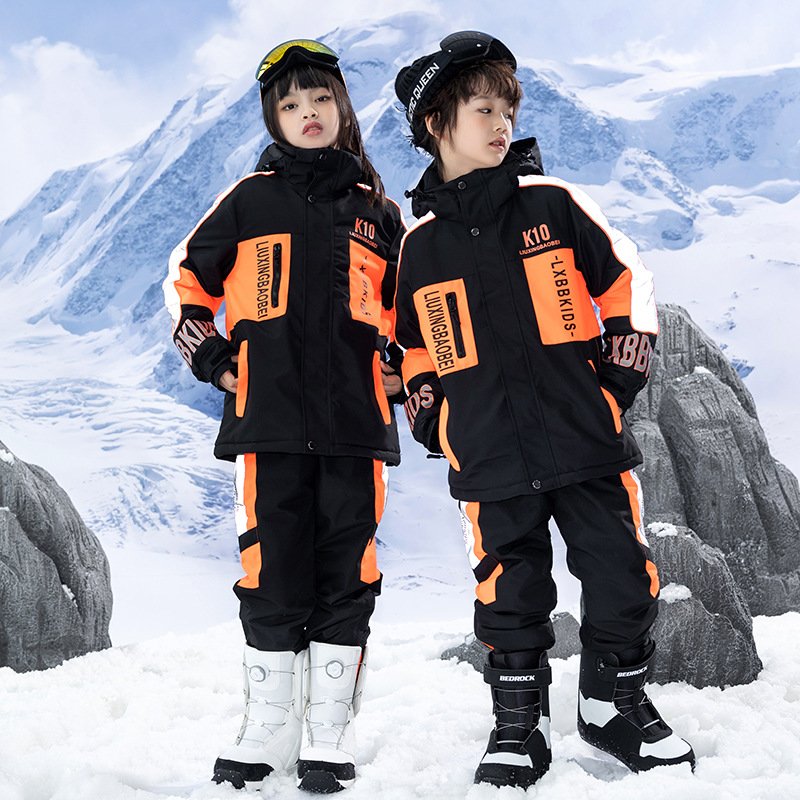 New ski suit for boys and girls in a winter outdoor weather and water-proof and thick ski pants