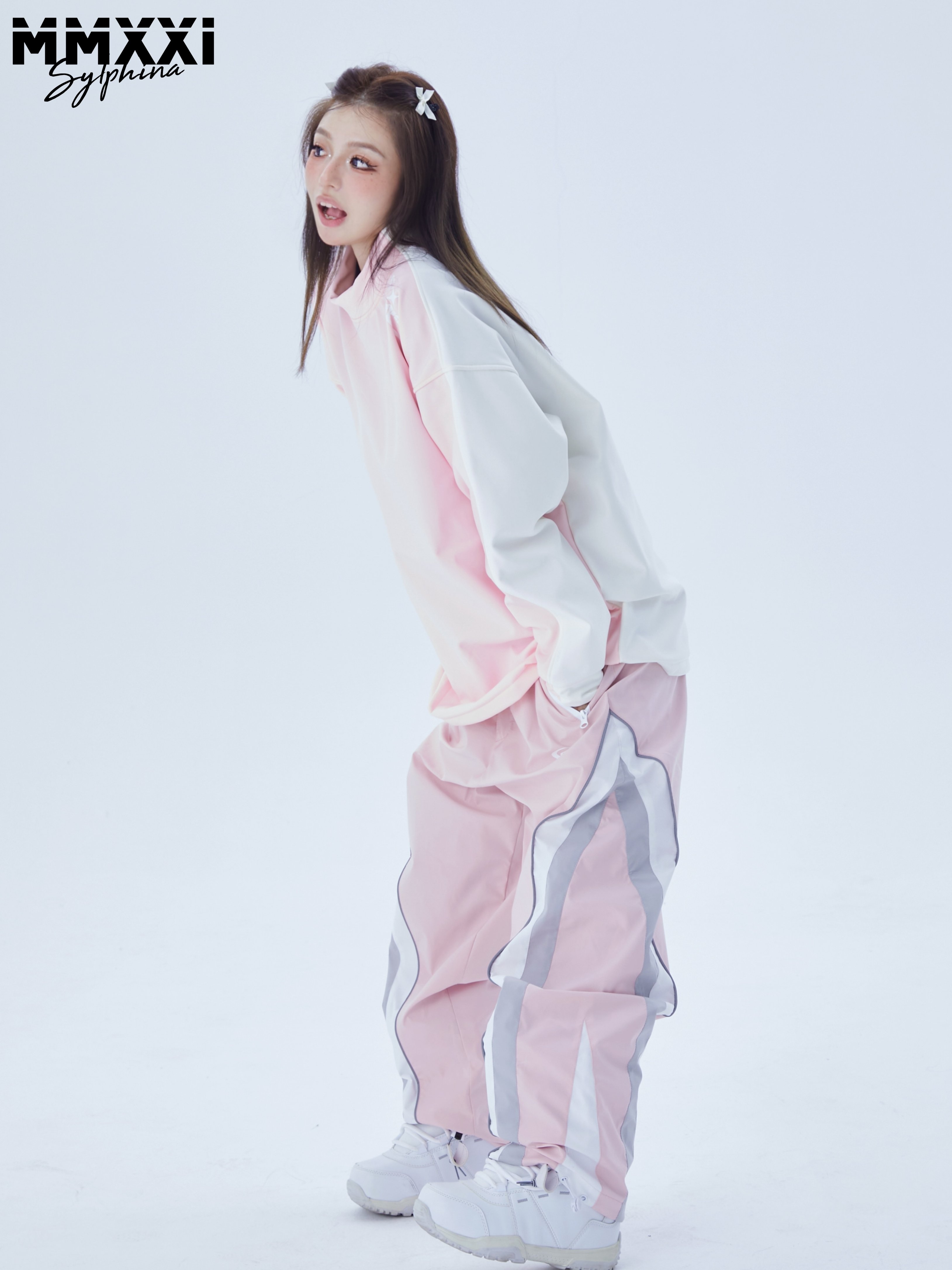 Men and women with pink, white and fluffy skis