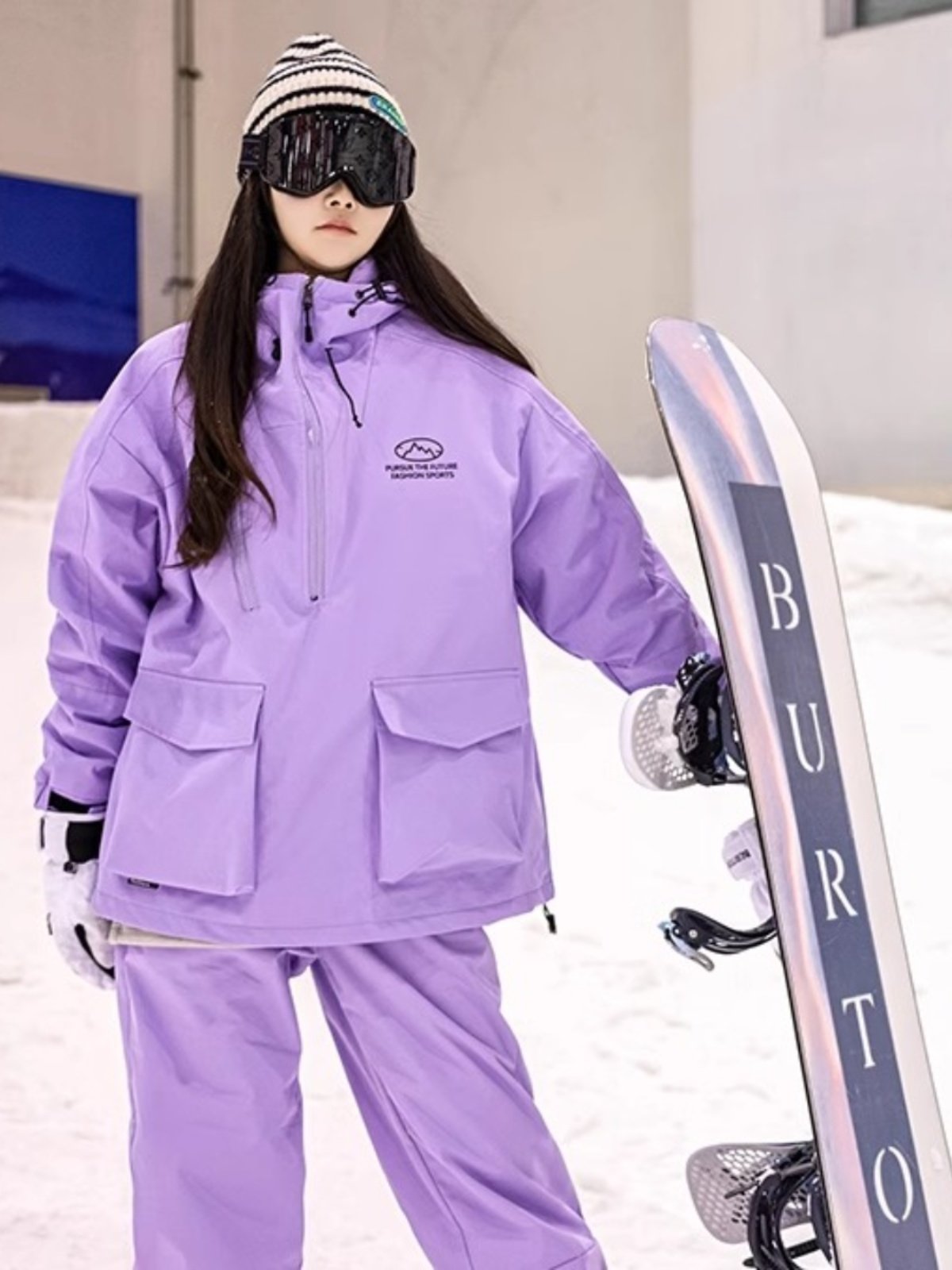 An outdoor ski suit, a man and a woman with a single, loose coat with a pair of ski pants