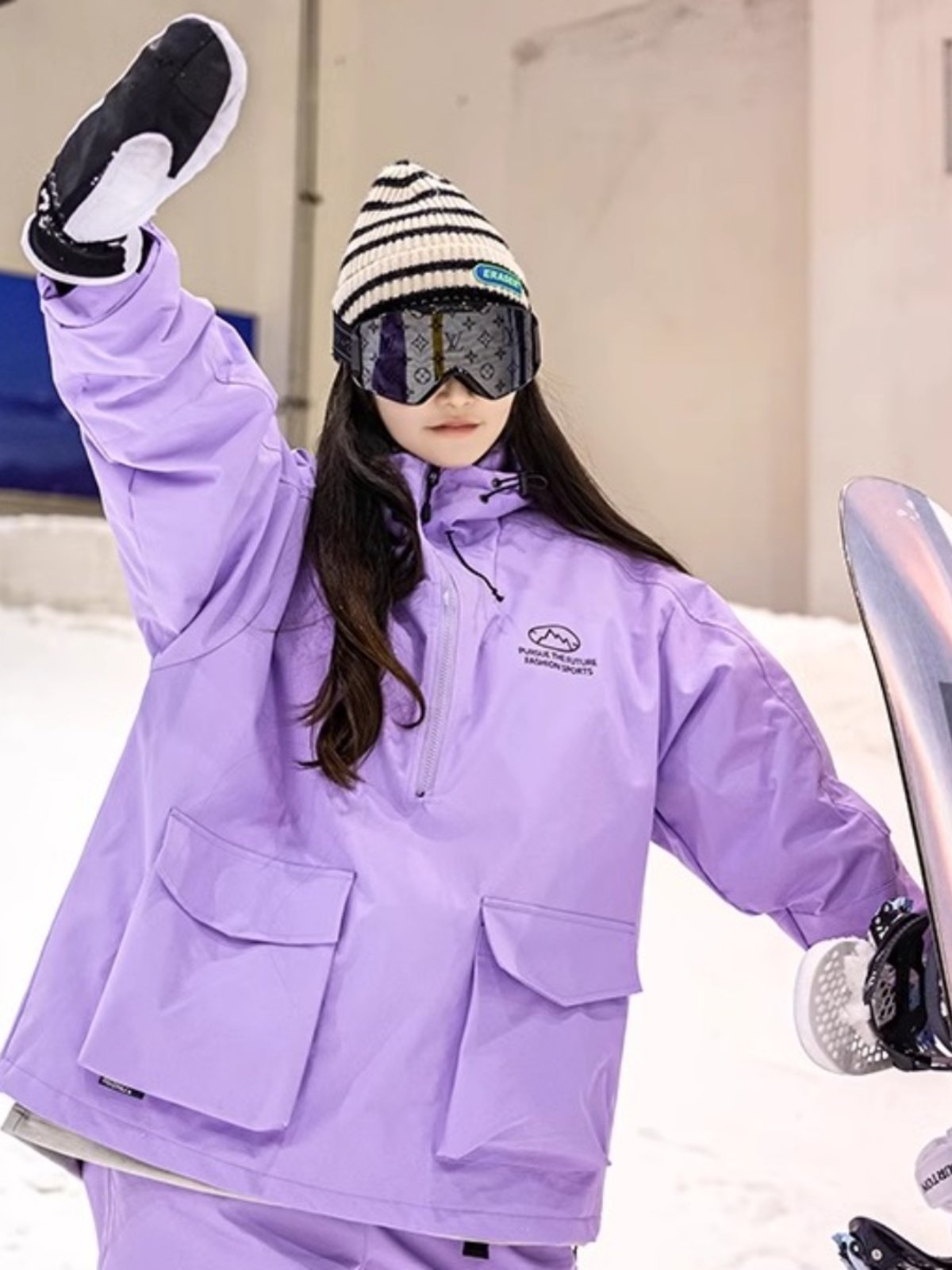 An outdoor ski suit, a man and a woman with a single, loose coat with a pair of ski pants
