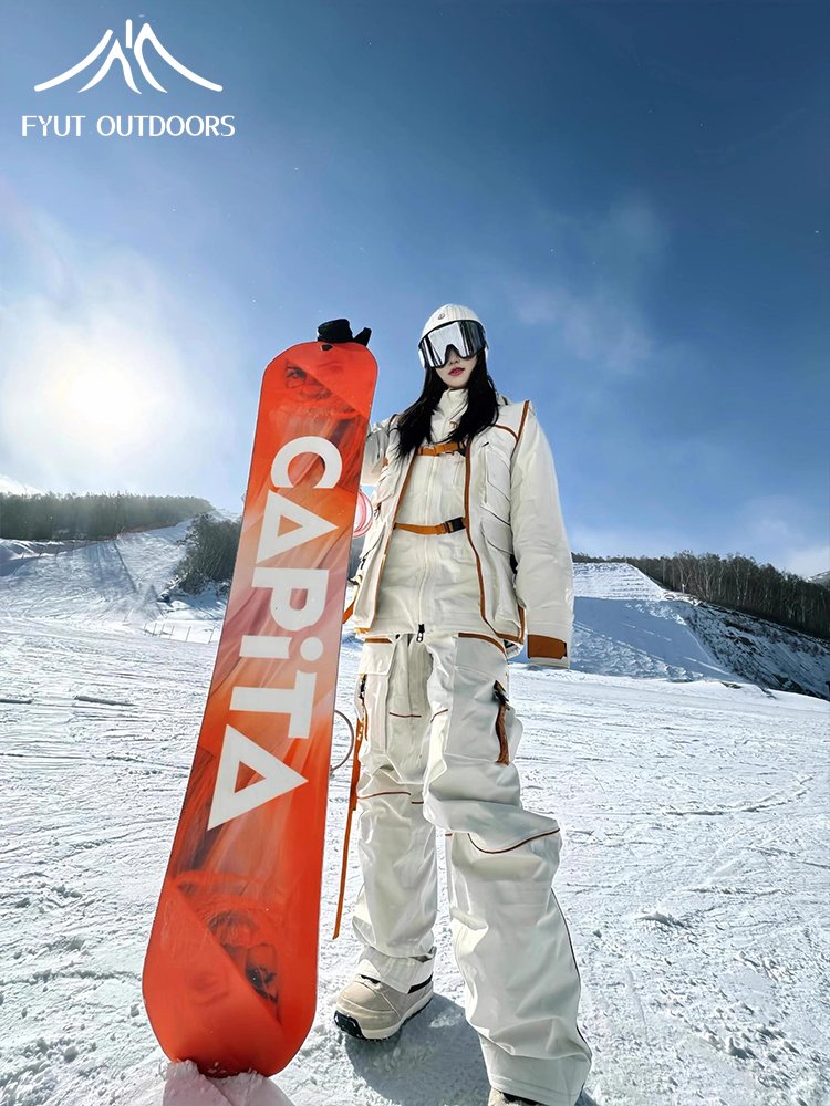 New man and woman, two-board sports, mountain-mounted suit with an autumn and winter ski suit, waterproof and warm