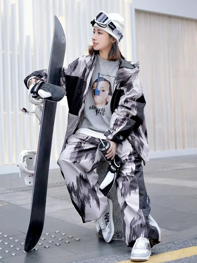 nowinsnow skisuits with a man and a woman in a waterproof scooter coat