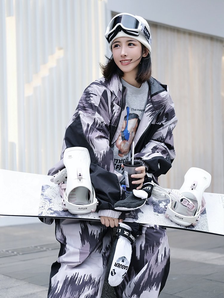 nowinsnow skisuits with a man and a woman in a waterproof scooter coat