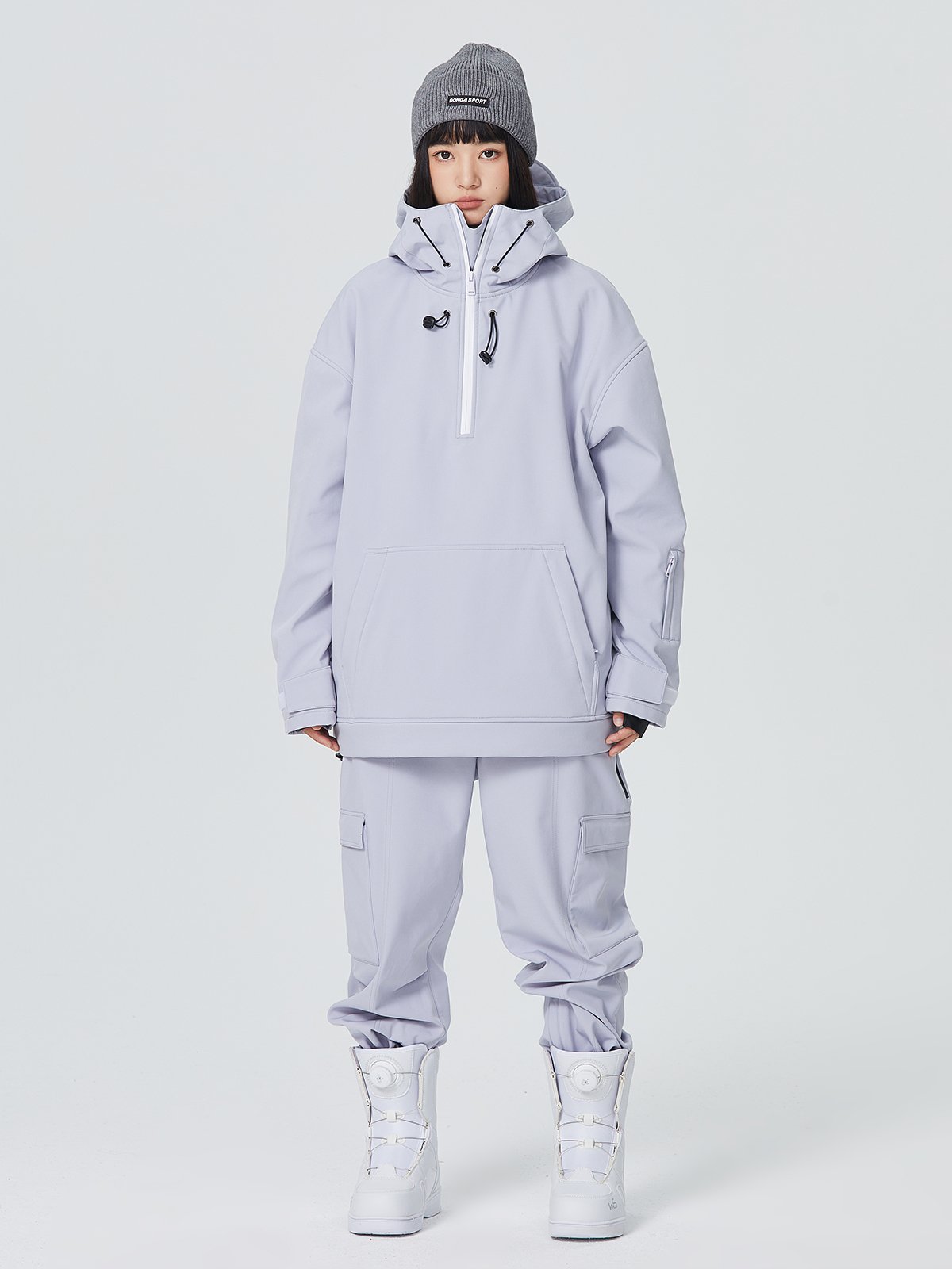 A man and a woman with a one-board double hoodie with a ski suit and a waterproof warmer
