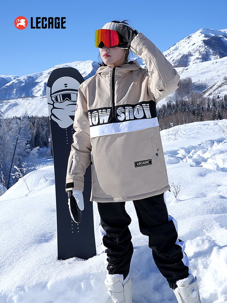 A guy with a ski suit in a water-proof, wind-proof skating suit