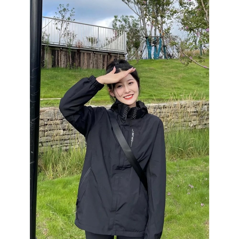 KAILAS Kalesulnasa, a man and a woman outside of the house, wearing a coat and a windproof waterproof jacket