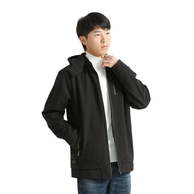 The man with the hot coats and the long sleeves of the hot and warm coats outside of his winter scooter