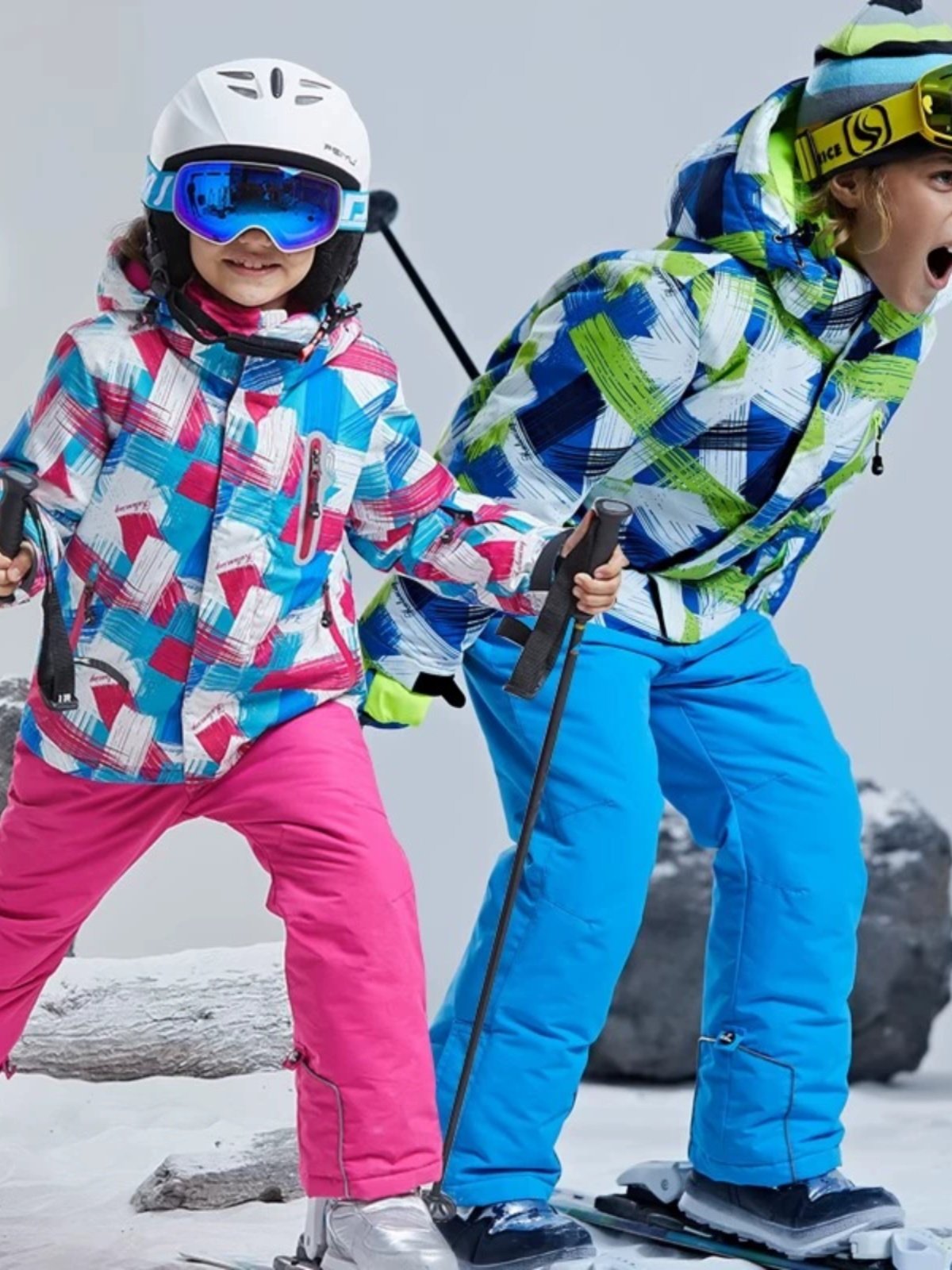 Ski gear for children with girls and boys in ski pants with thick partitions for windwater in the northeast