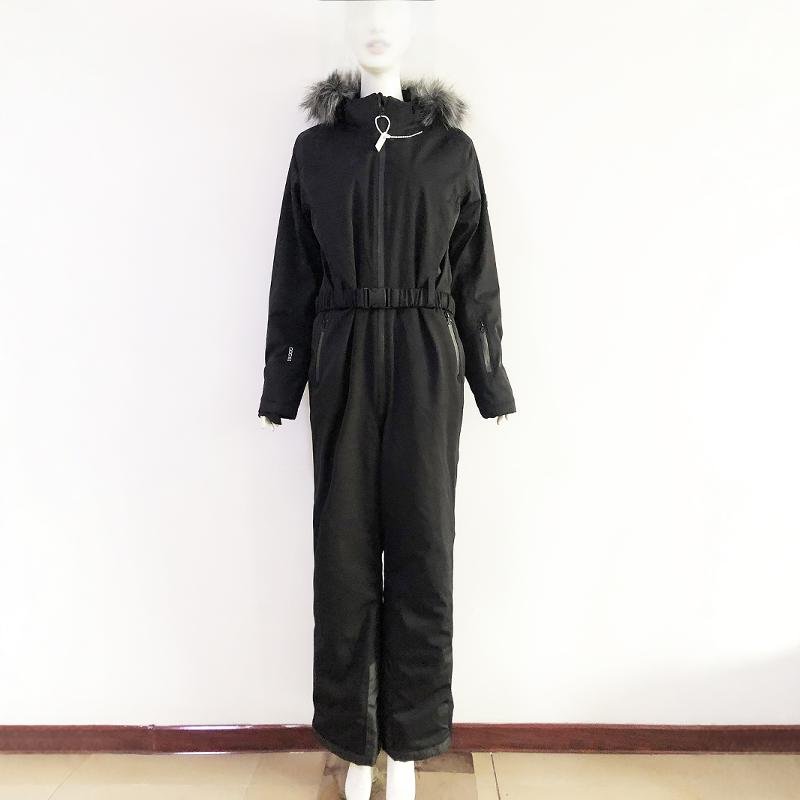 She's wearing a ski suit with a cotton and a thick scooter and a wind and waterproof double coat to keep her warm outside