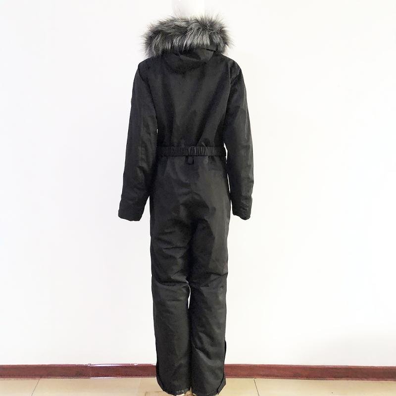She's wearing a ski suit with a cotton and a thick scooter and a wind and waterproof double coat to keep her warm outside