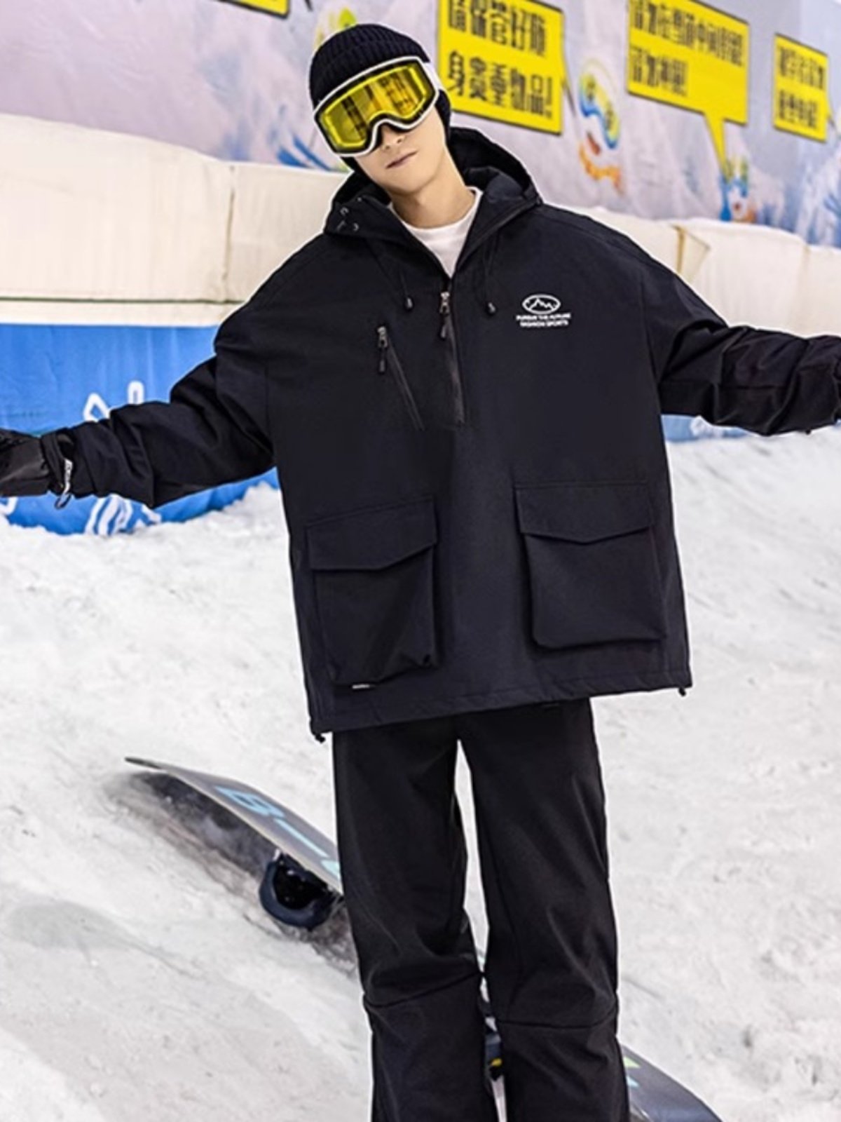 An outdoor ski suit, a man and a woman with a single, loose coat with a pair of ski pants