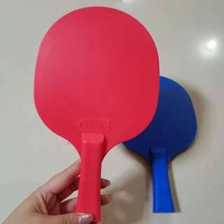 A pair of plastic rackets