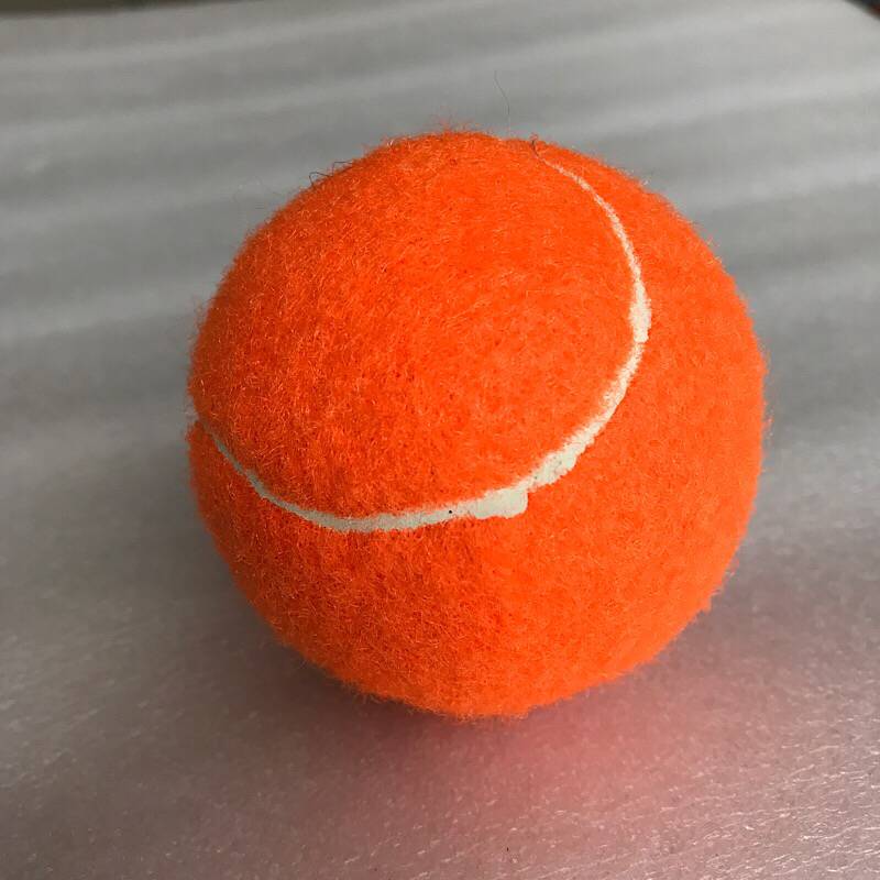 Orange high tennis ball