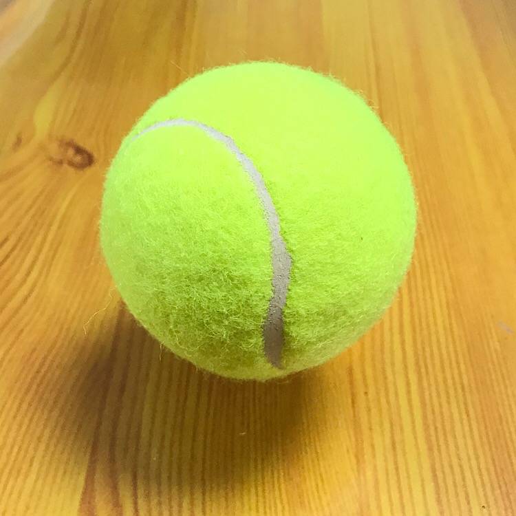 fluorescent green tennis ball (conventional colour)