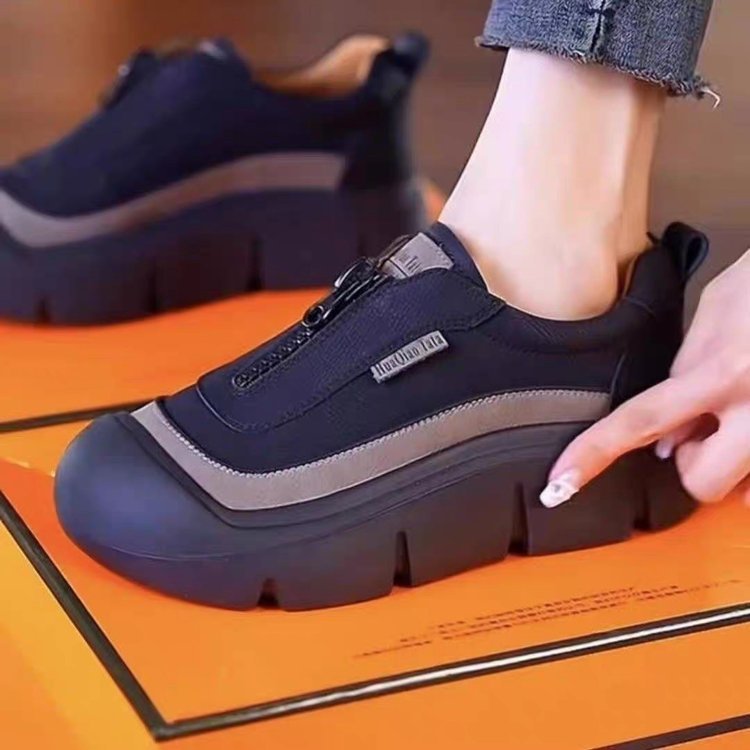 She's wearing a big, fat, fat-footed sneaker in 2024