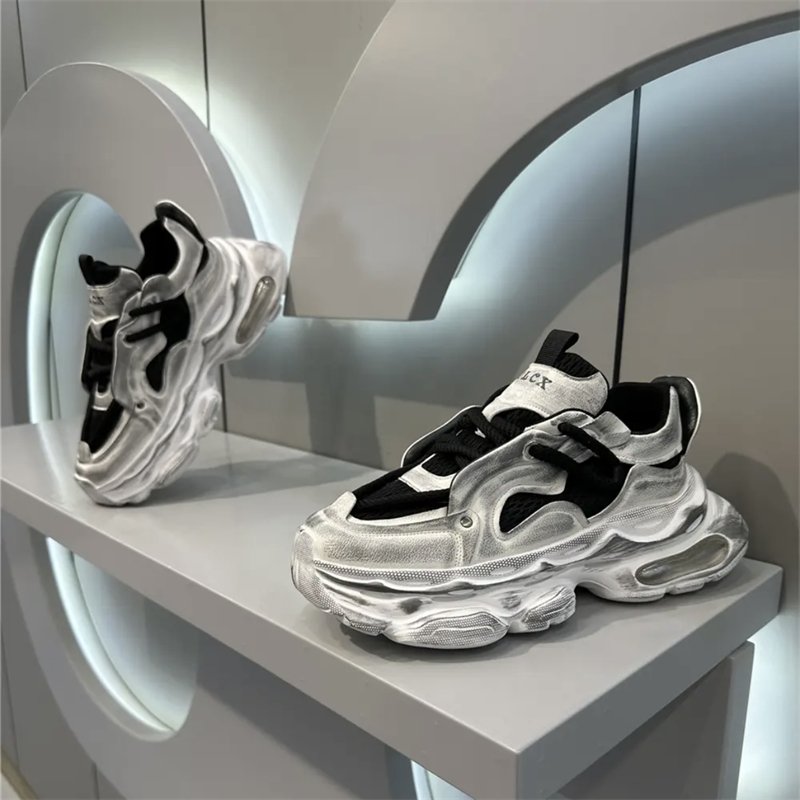 A man's shoes in the autumn make his old sneakers' gas pads so he can grow up