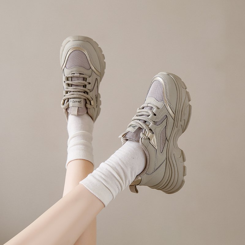 Black sneakers stomping on the shit in the spring