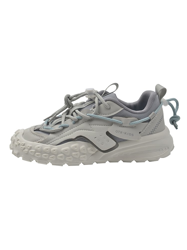 Big old man's shoes and girls' summer shoes
