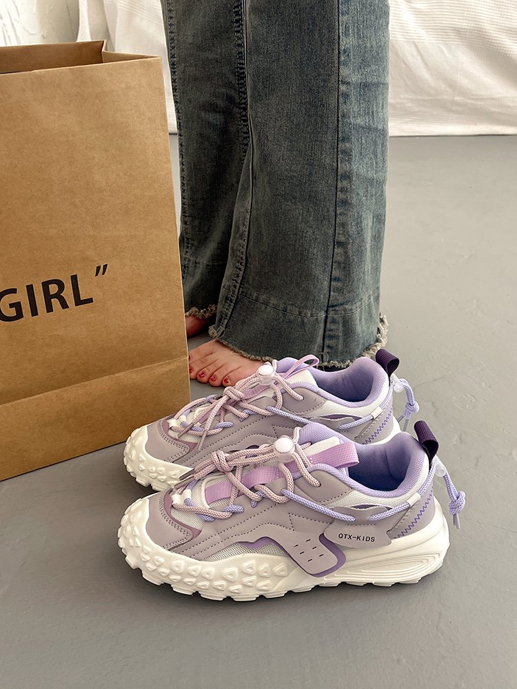 Big old man's shoes and girls' summer shoes