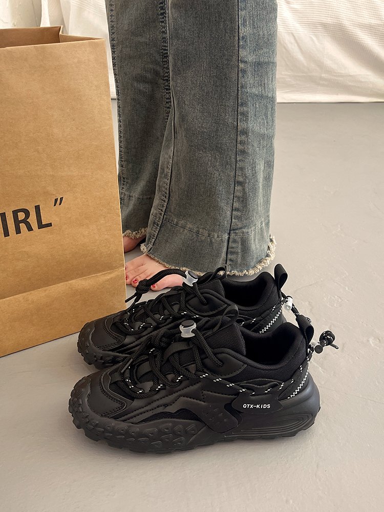 Big old man's shoes and girls' summer shoes