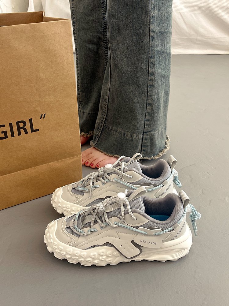 Big old man's shoes and girls' summer shoes