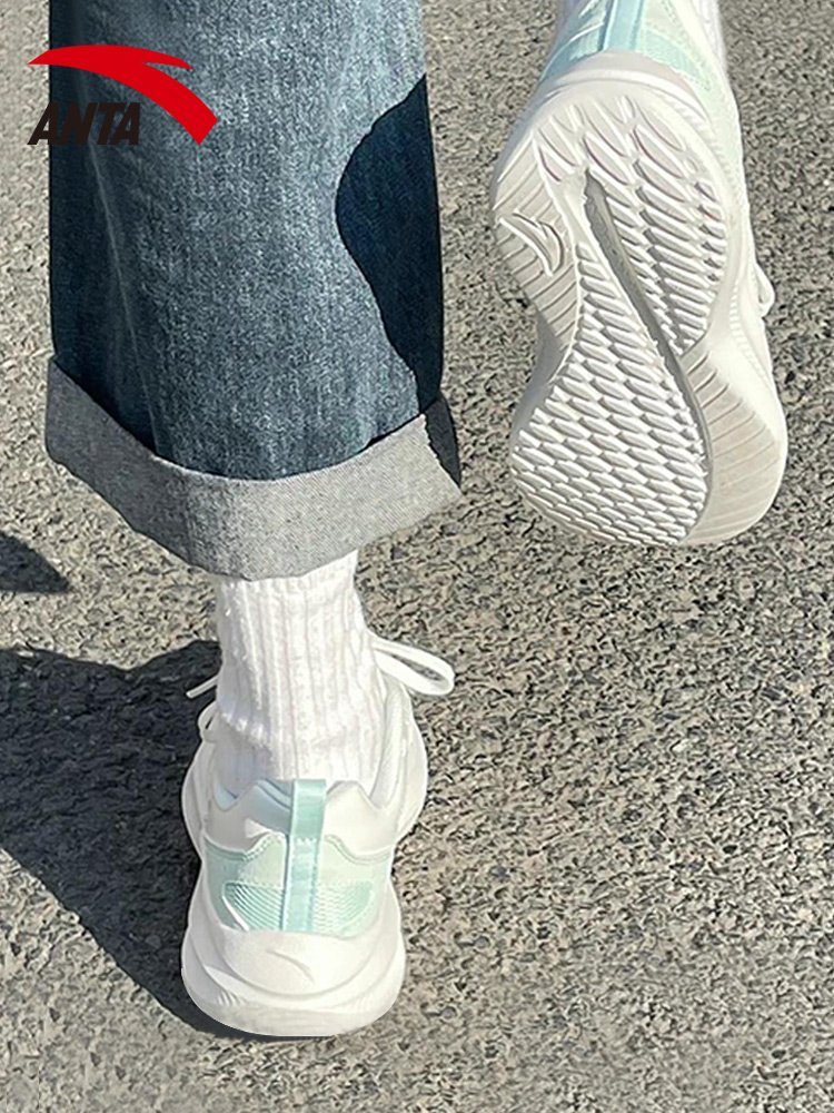 A girl with a girl's shoes is flying in the fall