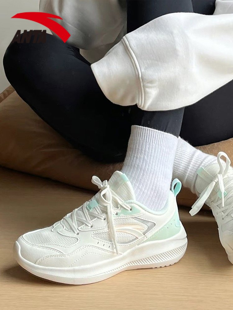 A girl with a girl's shoes is flying in the fall