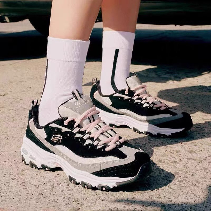 The 10th anniversary of Skechers and Cage's girls' black and white panda's shoes are so thick that they're high in their air that they're up in their spare time