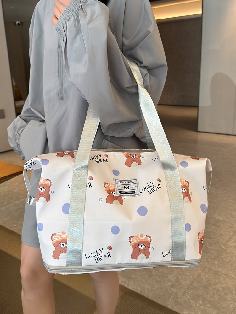 A large-capacity lady's hand-carrying bag for a short trip to travel with a stick for delivery