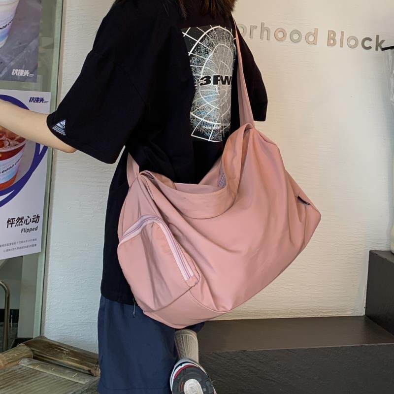 A sports bag with a large-capacity short-distance travel bag, a one-shoulder bag with a slant bag