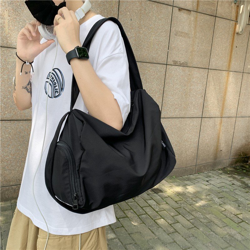 A sports bag with a large-capacity short-distance travel bag, a one-shoulder bag with a slant bag