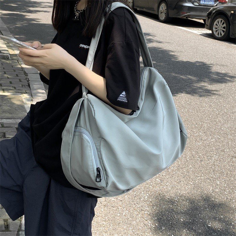 A sports bag with a large-capacity short-distance travel bag, a one-shoulder bag with a slant bag
