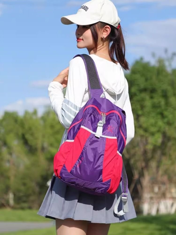 A super light-skinned man can easily fold a pair of shoulderbags during the summer and carry a large sport backpack