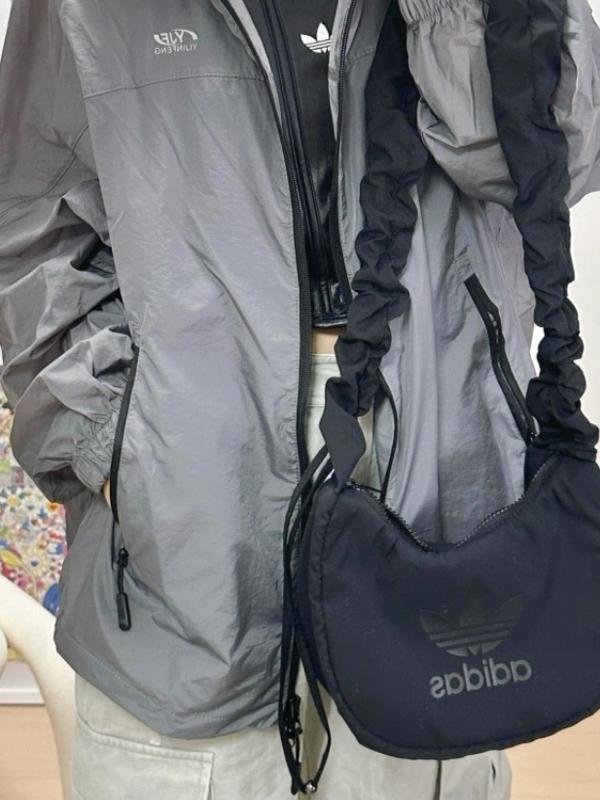 A new 2024 cloud packs under Adi's three-leaved arcade, and a one-shoulder to her