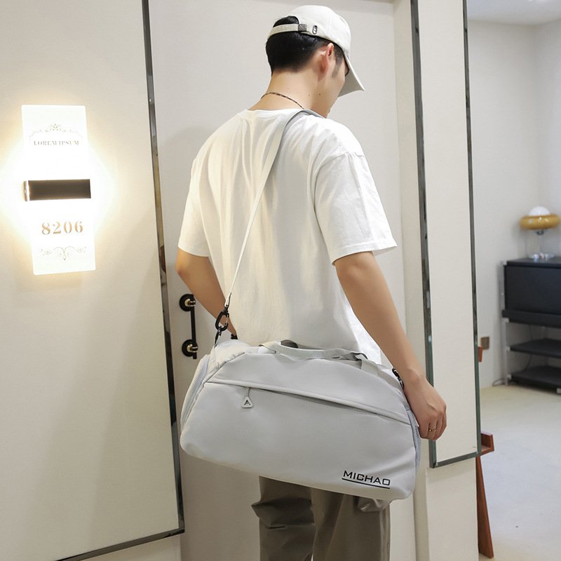 A sports bag with a swim and a yoga bag with a light shoulder and a short trip