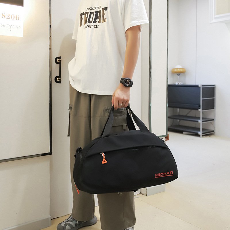 A sports bag with a swim and a yoga bag with a light shoulder and a short trip