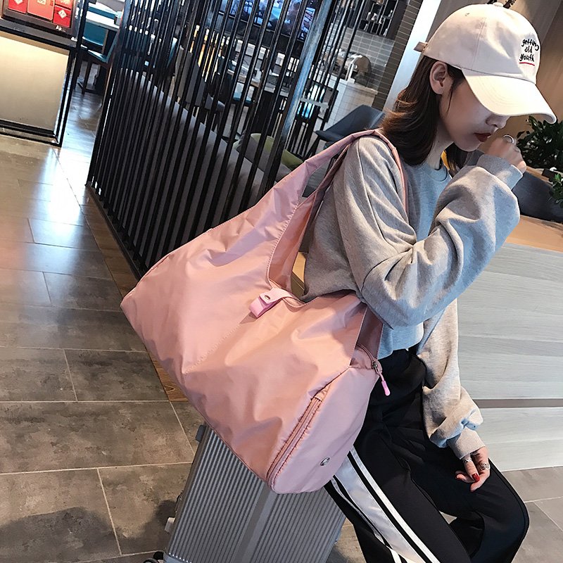 A sports bag with a swim and a yoga bag with a light shoulder and a short trip