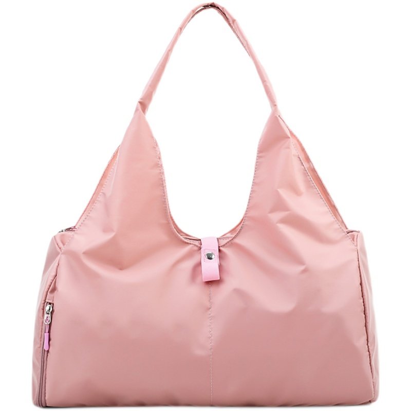A sports bag with a swim and a yoga bag with a light shoulder and a short trip