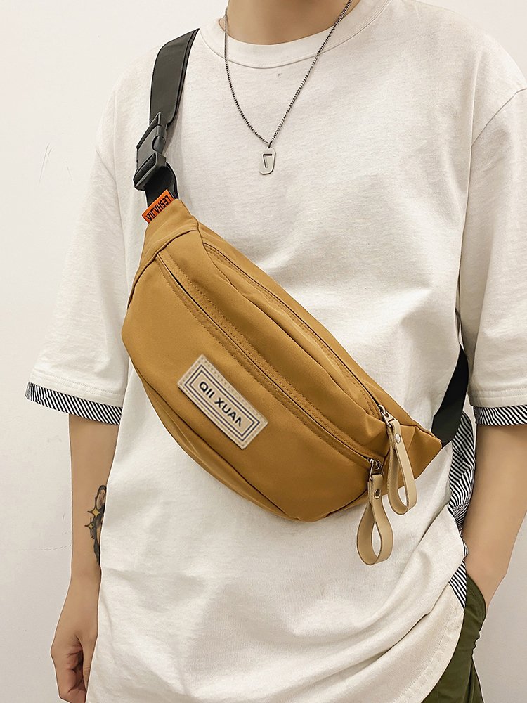 A slashy-packed man with a one-shoulder chest bag and a sashy-tip-sleeve