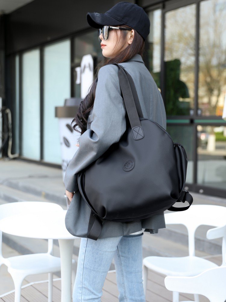 fashion packs a handbag with a handbag and a nylon pack