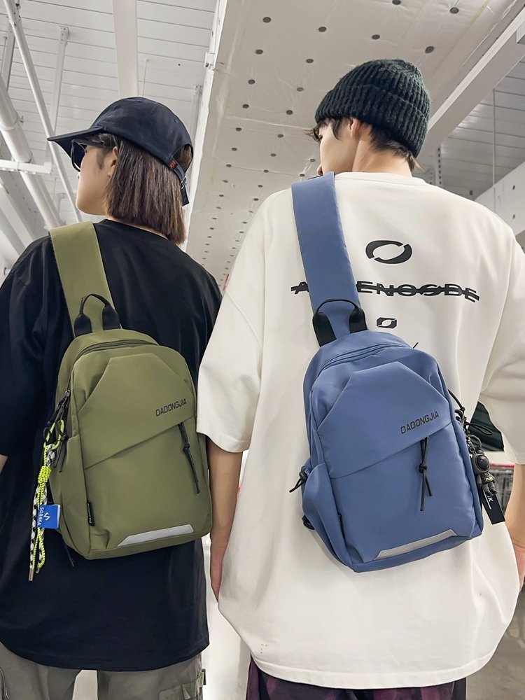 A slashy-packed, one-shouldered backpack for a boy with a chest bag for a girl who rides around the mountain and walks around