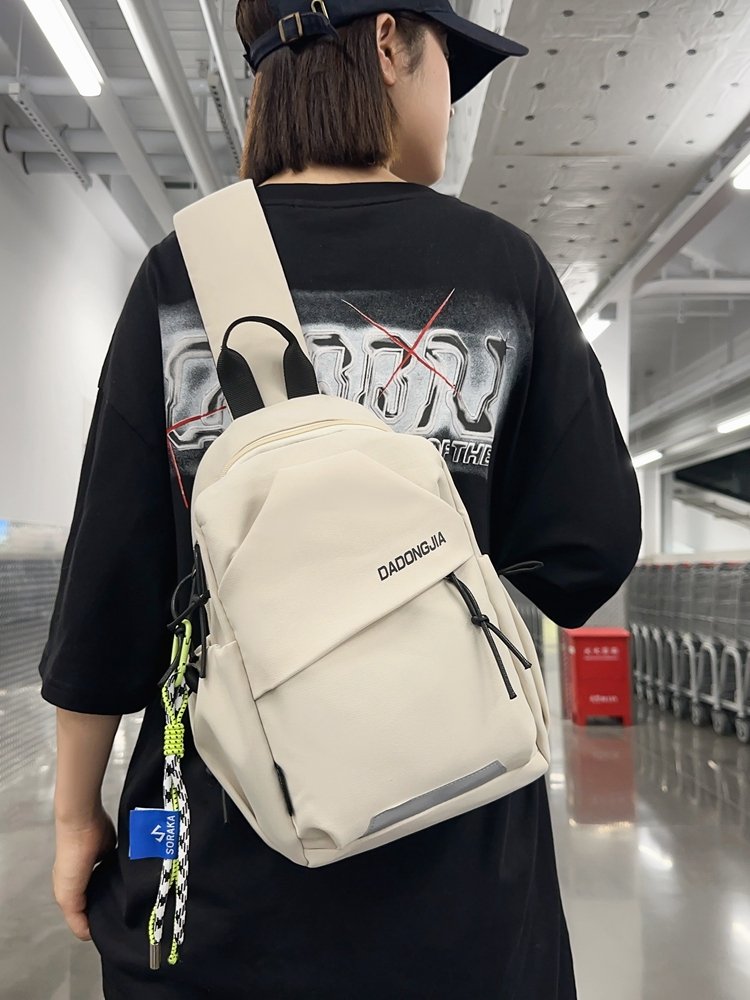 A slashy-packed, one-shouldered backpack for a boy with a chest bag for a girl who rides around the mountain and walks around