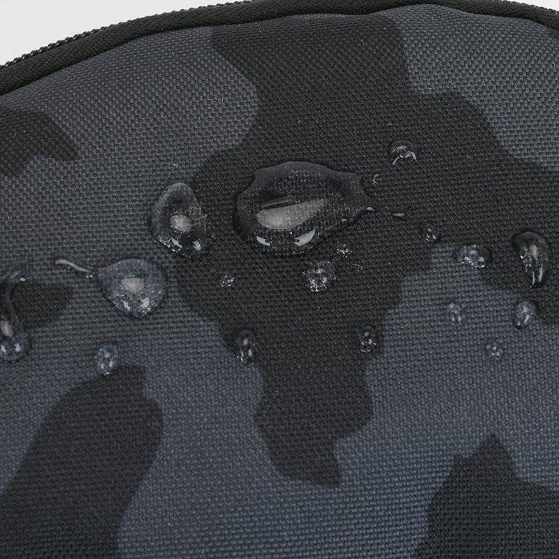 Oxford Rolling-A-Winger handsets for men's work, collecting their wallets from a water-protected tarpaulin business