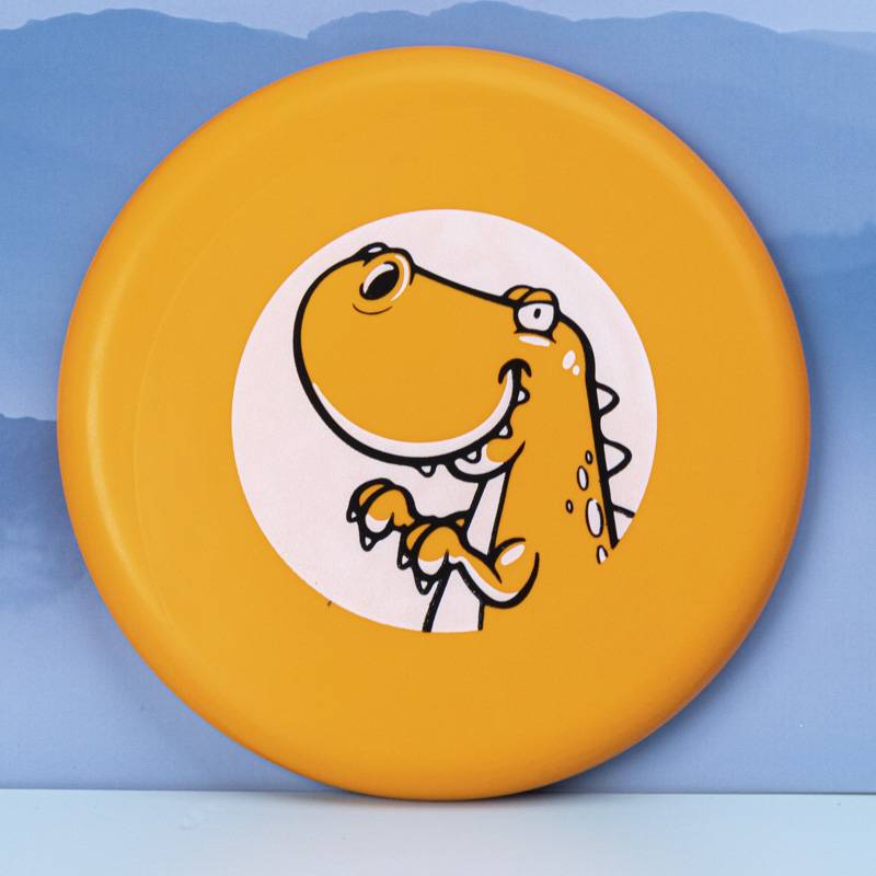 Orange dinosaurs with a large, outdoor floppy disk