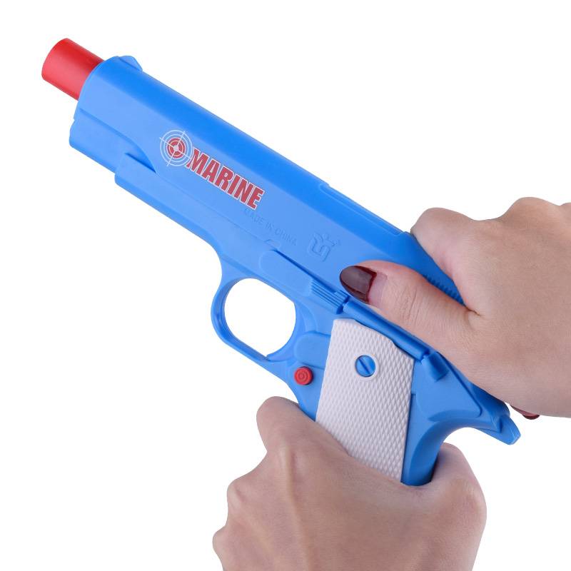 Children's soft shotgun toys can fire soft bombs shooting against the battle glasses handcuffed boy