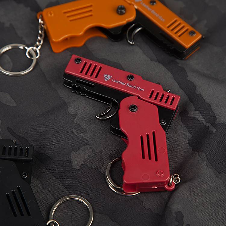 Yingtu folding skin tendon gun children's toy metal six -linked rubber band pistol keychain boy soft shotgun