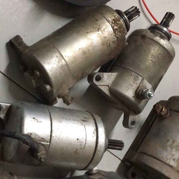 Dismantling the oil contaminated motorcycle starter motor in the factory